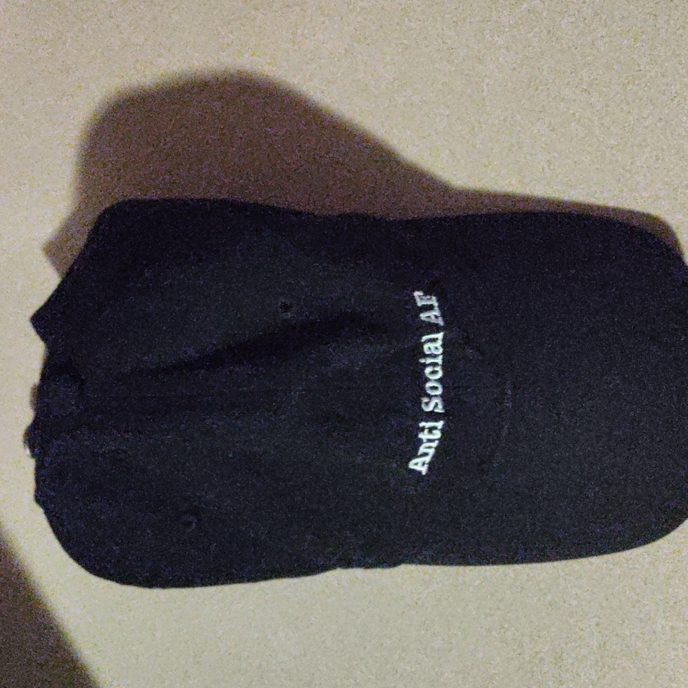 Black with white letters."Anti Social AF" baseball cap..from Spencer's.